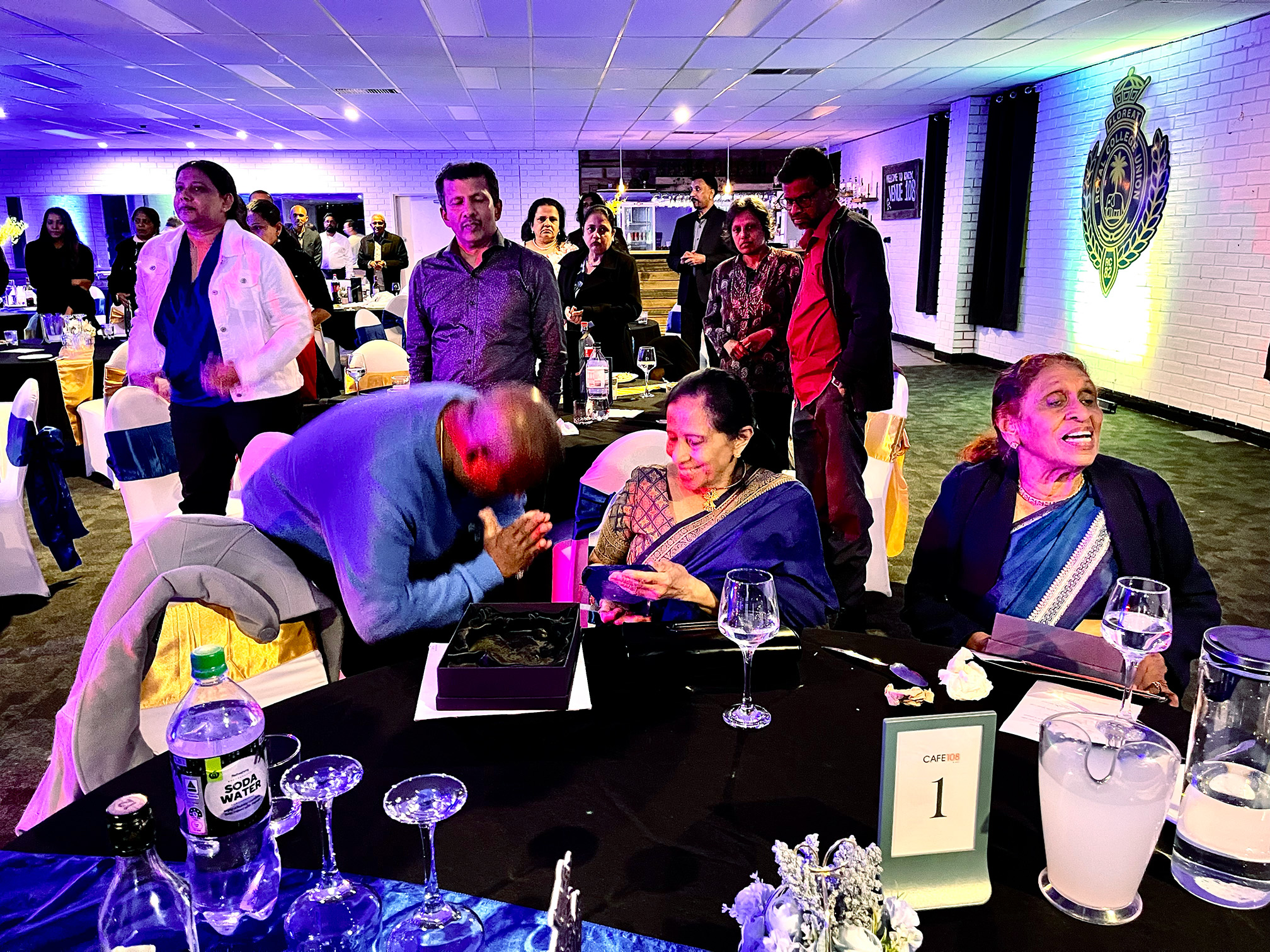 Lal Awarding the teachers a plaque